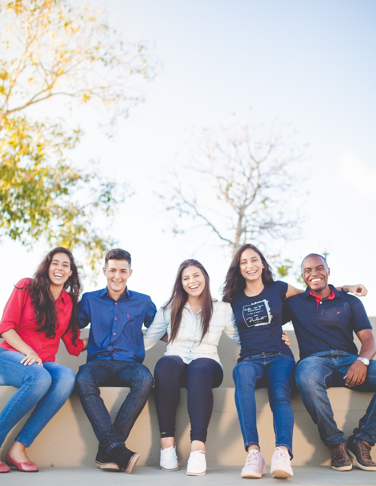 Group of diverse students sitting together